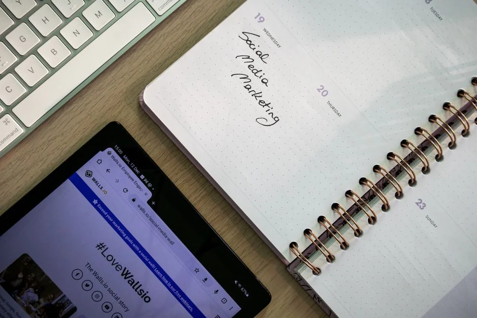 Close-up of a notebook page with Social Media Marketing handwritten on it.